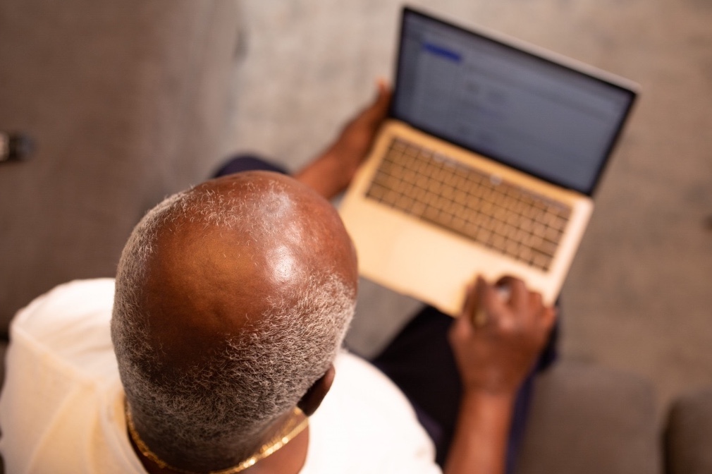 man in white shirt macbook