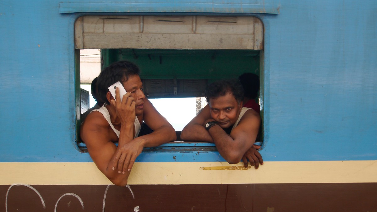 Two men with mobile phone